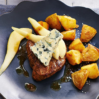 steak with fried pear and orange gravy
