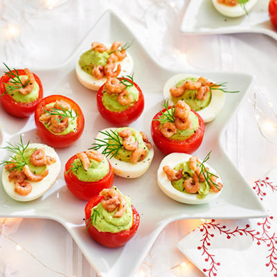 eggs and tomatoes filled with avocado cream