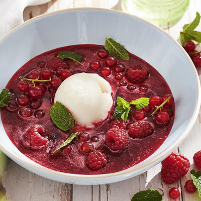 cold raspberry soup with ice and red berries