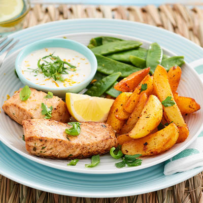 baked salmon with herb sauce and baked potatoes