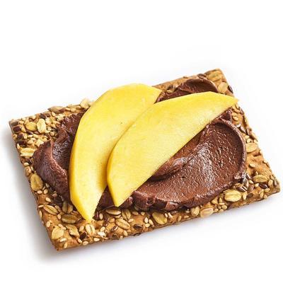 wholemeal cracker with homemade chocolate spread and mango