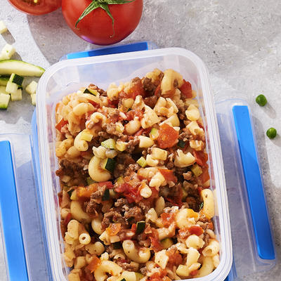 baby snack pasta with minced meat, tomato and zucchini