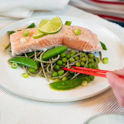 thai noodles with green vegetables and steamed salmon