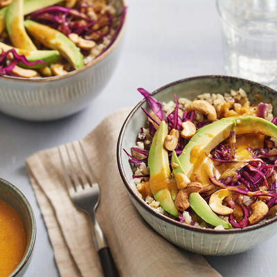 bowl with cauliflower rice, avocado, red cabbage and cashew nuts