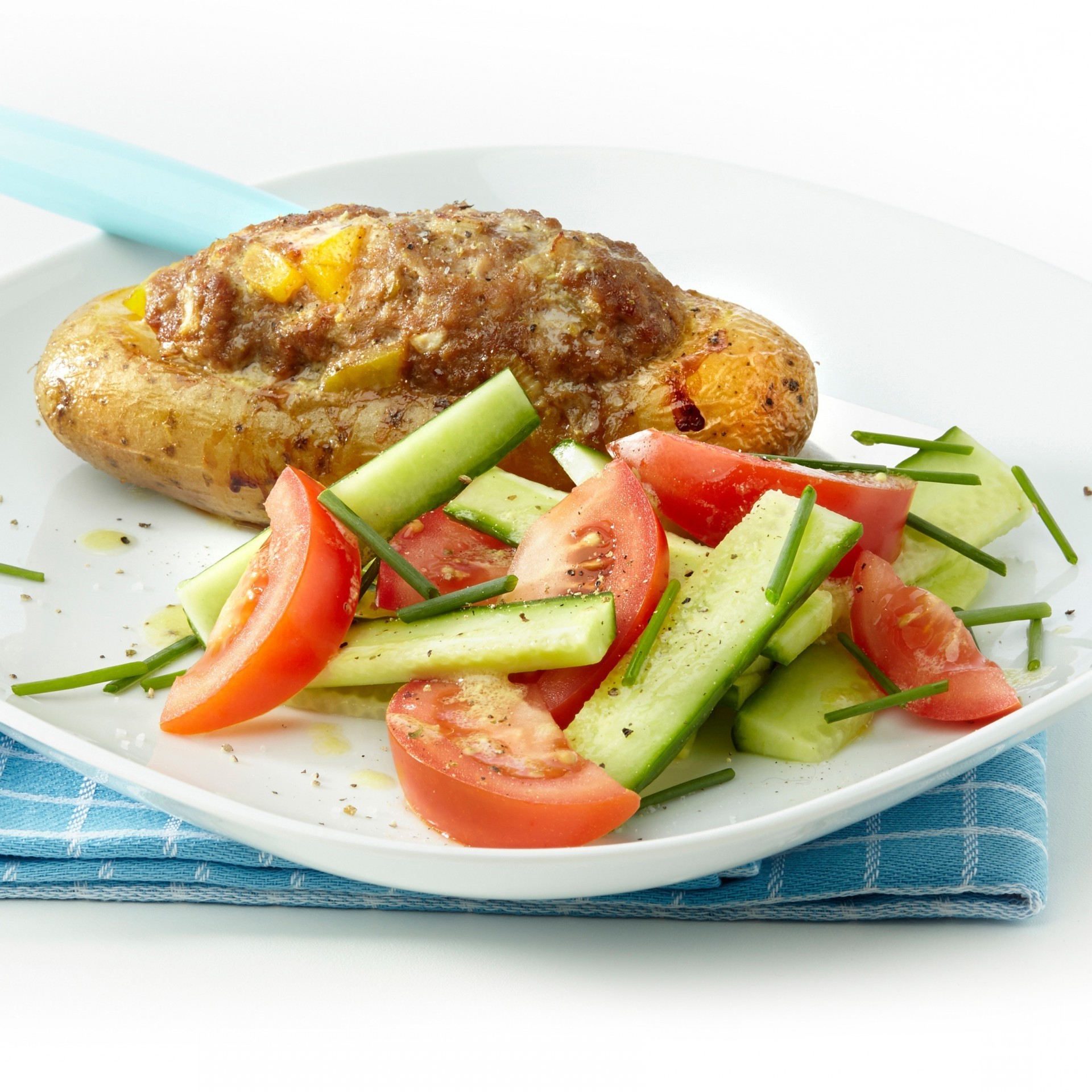 Stuffed potato with minced meat and salad Stuffed potato with minced meat and salad