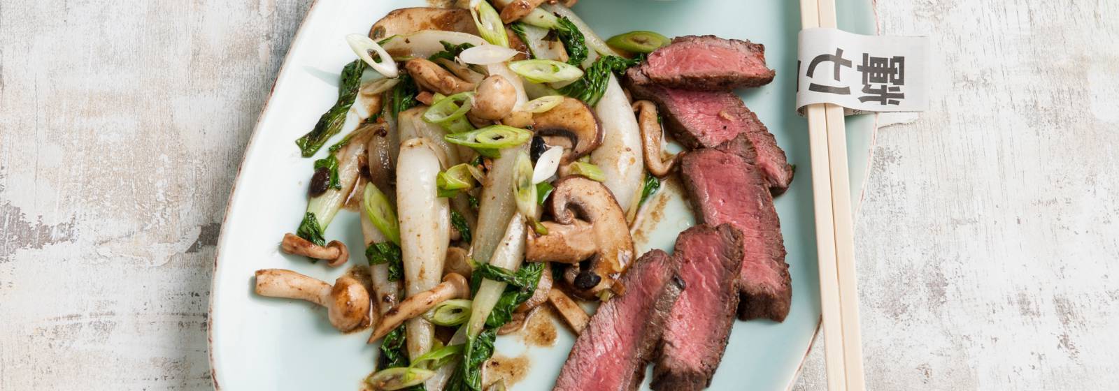 Baby pak choi with wok mushrooms and steak in black bean sauce Baby pak choi with wok mushrooms and steak in black bean sauce