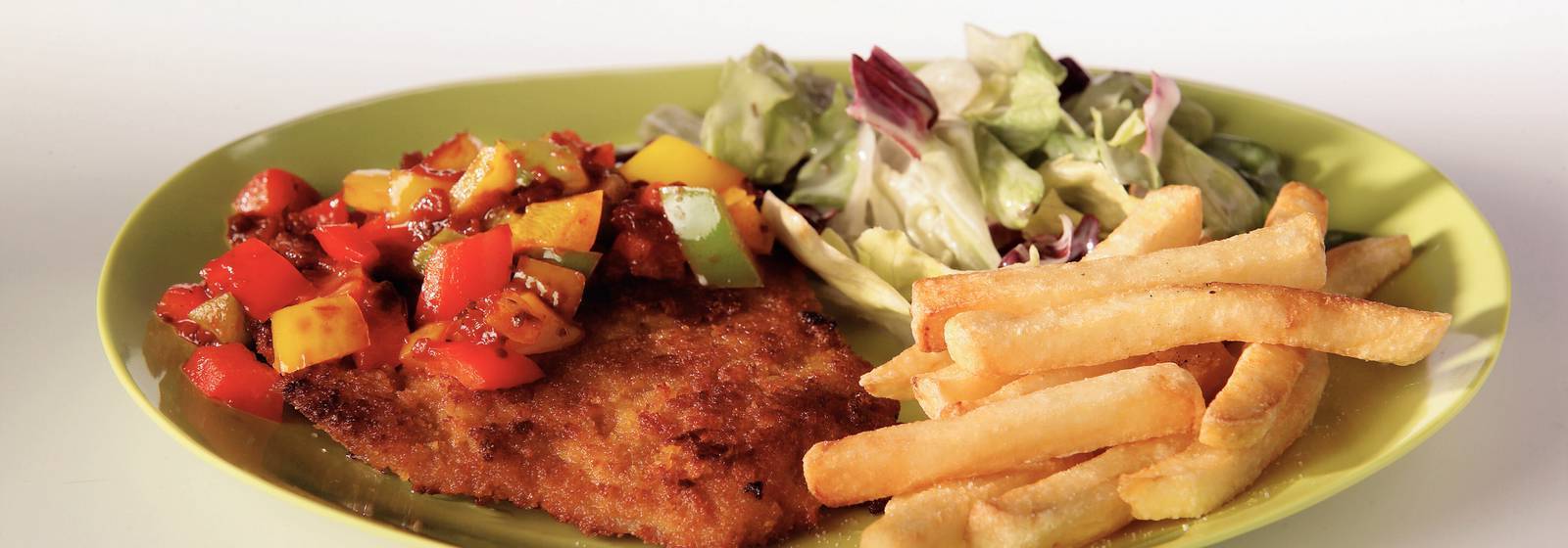 Schnitzel with paprika sauce and French fries Schnitzel with paprika sauce and French fries