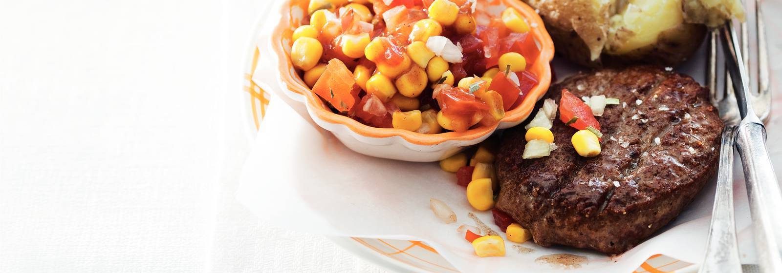 Beefburger and tomato-corn salad Beefburger and tomato-corn salad